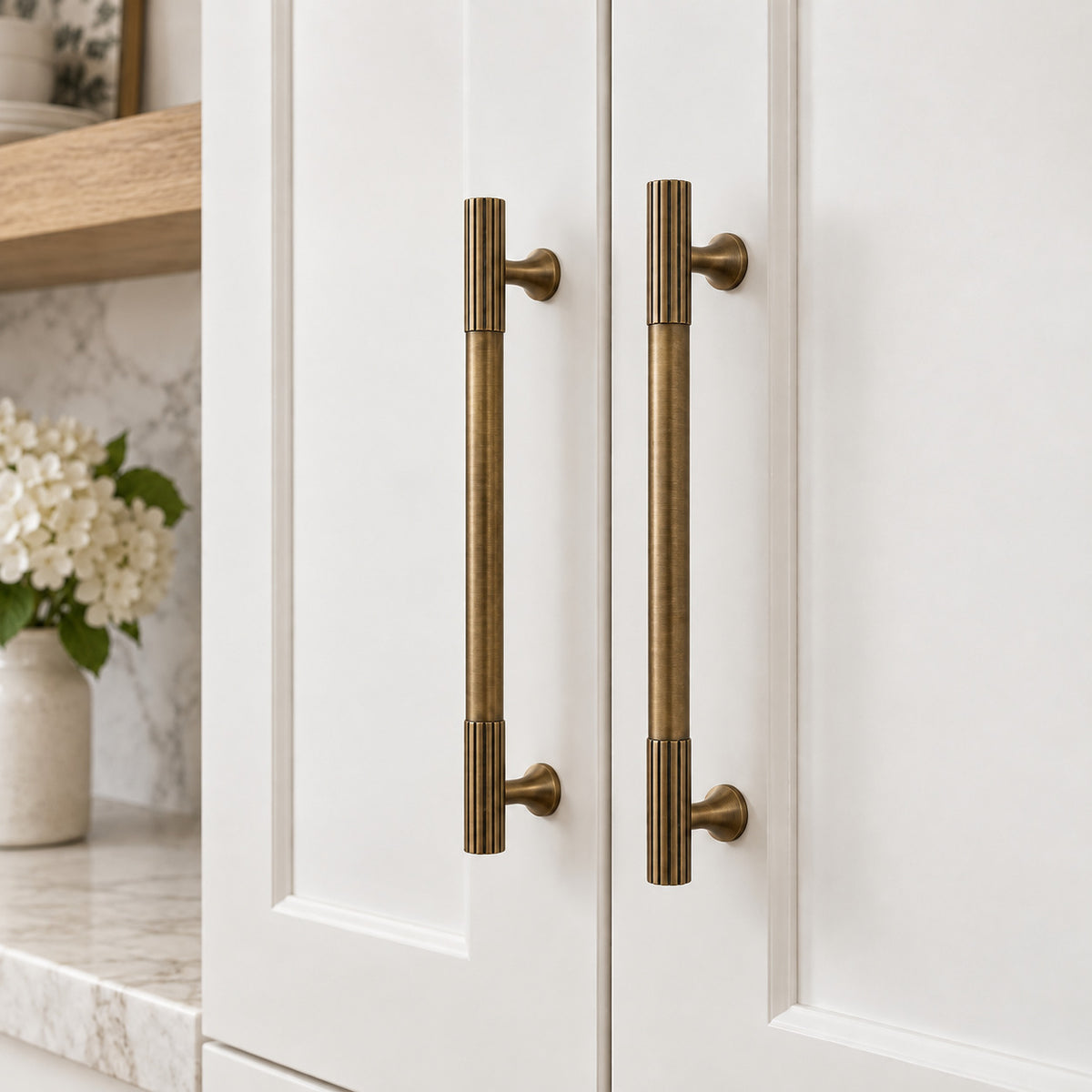 PLEAT Fluted Cabinet Pull in Antique Brass — shown on cabinetry
